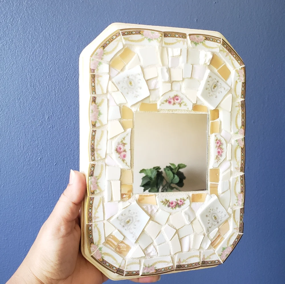 Genuine pique assiette mirror